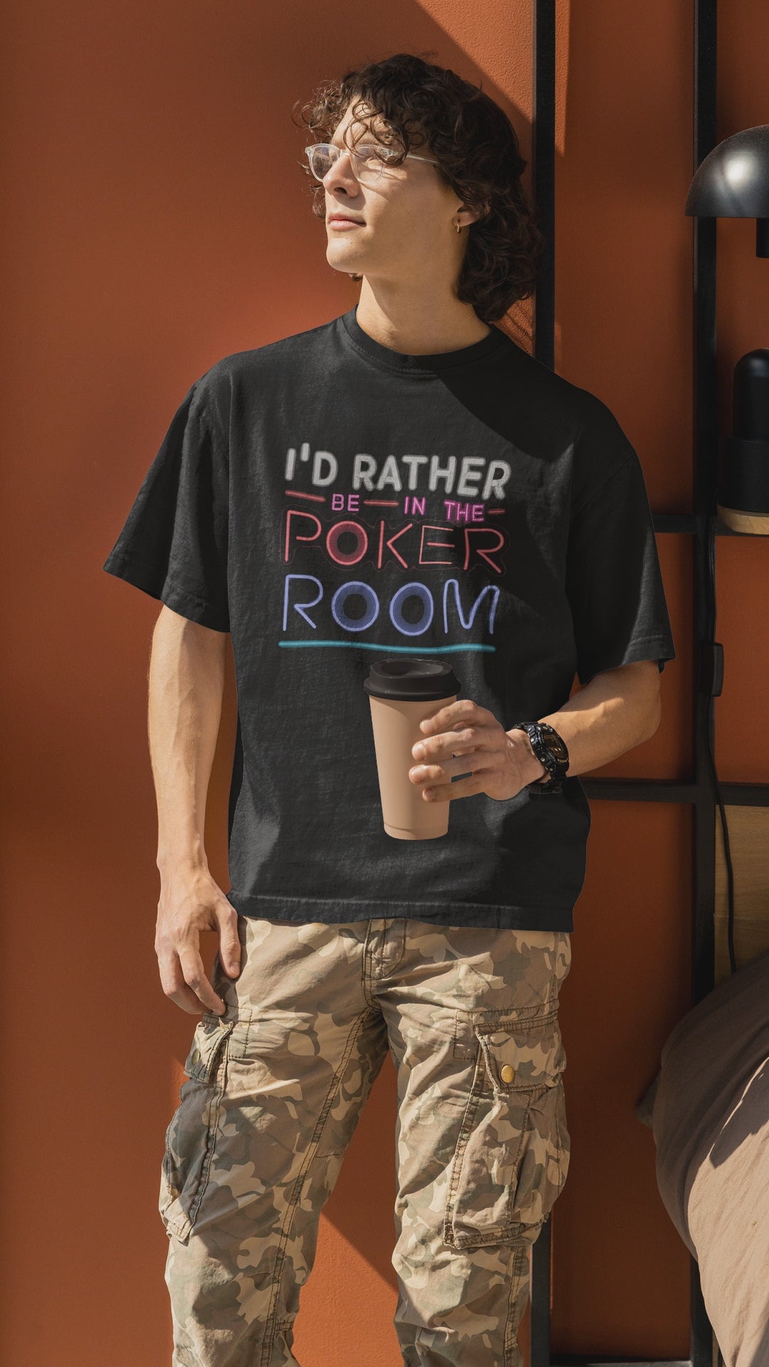 how your love for the game with the "I'd Rather Be in the Poker Room" t-shirt! This comfortable tee is perfect for poker enthusiasts who dream of chasing that royal flush or bluffing their way to victory. Made from high-quality, breathable fabric, this t-shirt is ideal for long nights at the table or casual wear that lets everyone know where your heart lies.  Available in various sizes, this poker tee makes a fantastic gift for any player.  Rep your passion for the game - order yours today!